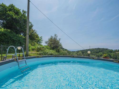 a swimming pool with a view of the mountains at Holiday Home Bellavista by Interhome in Strettoia