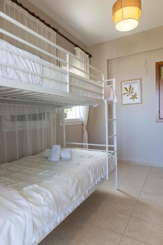a bedroom with two bunk beds in a room at The Olympus Estate in Litochoro