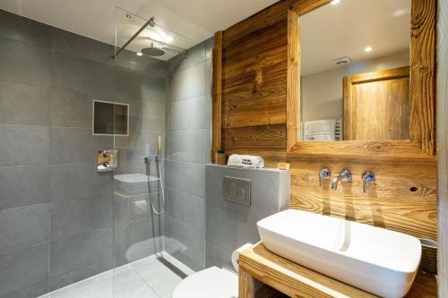 a bathroom with a sink and a shower at Chalet du Dard - Chamonix All Year in Chamonix-Mont-Blanc