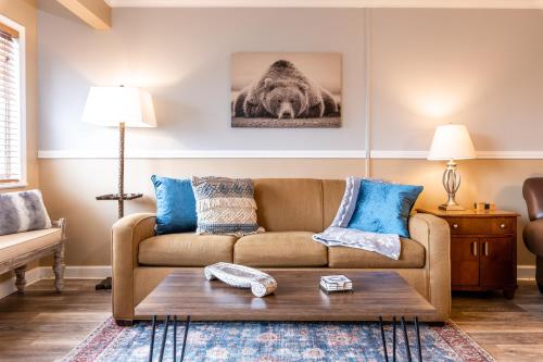 a living room with a couch and a table at SKY HIGH VIEWS!!-Peak Mountaintop-Outdoor Pool-Close to Downtown-Private Balcony-WiFi-Cable in Gatlinburg