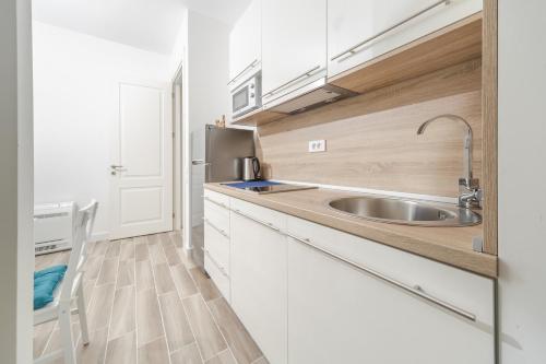 Kuchyň nebo kuchyňský kout v ubytování La barca apartments