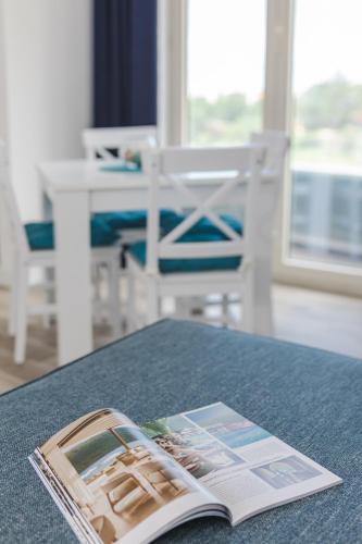 a magazine sitting on top of a table at La barca apartments in Becici