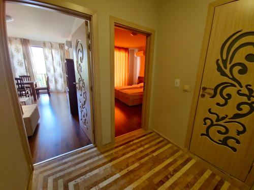 a hallway with a door leading to a bedroom at Diamond Beach Sarafovo by KP in Burgas City