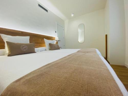 Cama o camas de una habitación en Apartamentos Palacio Alemar