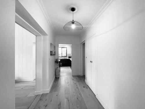 a living room with a hallway with a ceiling at La Villa Familiale La Palmyre in Les Mathes