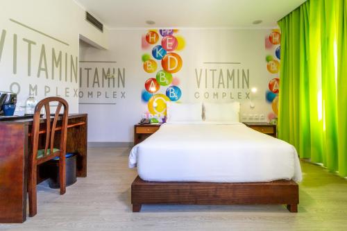 a bedroom with a white bed and a desk and a green curtain at Hotel A.S. Lisboa in Lisbon