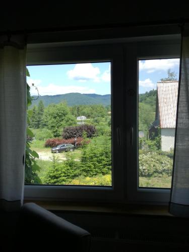 a window with a view of a mountain view at Podołynia in Dwernik