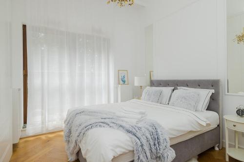 Postel nebo postele na pokoji v ubytování Woronicza - Margo Apart