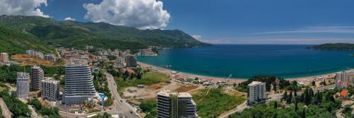 an aerial view of a city and a beach at La barca apartments in Becici