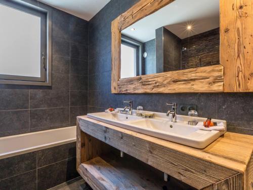 a bathroom with a sink and a mirror at Appartement Val-d'Isère, 5 pièces, 8 personnes - FR-1-694-96 in Val-d'Isère