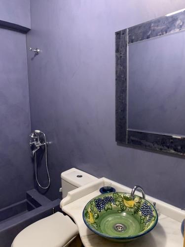 a bathroom with a sink and a toilet at Endless Seaview in Porto Rafti