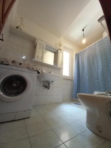 a bathroom with a washing machine and a sink at Da Isabella in Vernazza