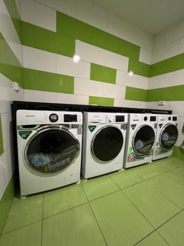 two washing machines in a laundry room at Kust Hostel in Kyiv