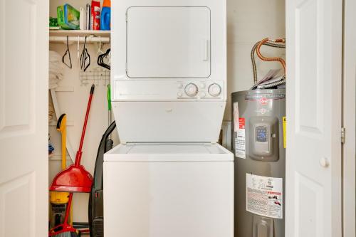 a refrigerator and a microwave in a small room at Lovely Crescent Bar Condo with Community Amenities! in Quincy