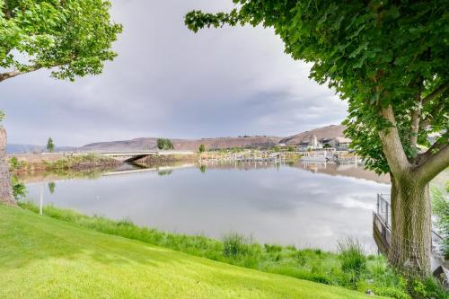 a body of water with a bridge and a tree at Lovely Crescent Bar Condo with Community Amenities! in Quincy
