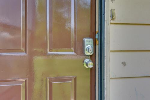 a door with a remote control attached to it at Cozy Youngstown Apartment with Central AandC and Heating in Youngstown