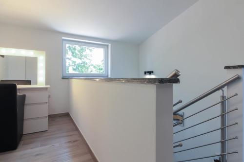 a bathroom with a counter and a sink in a room at Wonderful villa wit pool surrounded by nature, high level of privacy a few minutes to the beach and town center by car by WiiBuk in Valtura
