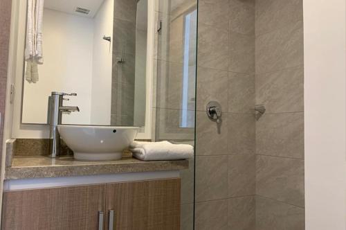 a bathroom with a sink and a shower at Apartahotel Connect Bogotá in Bogotá