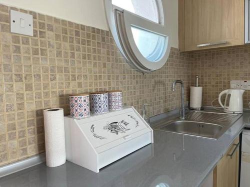 a kitchen with a sink and a counter top with a counter at Caesar resort & SPA, Claudius 2 bedroom apartment, Iskele, Long beach in Saint Yeorgios