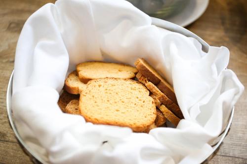 a basket filled with bread and biscuits on a table at Hotel Bellavista Locarno in Locarno
