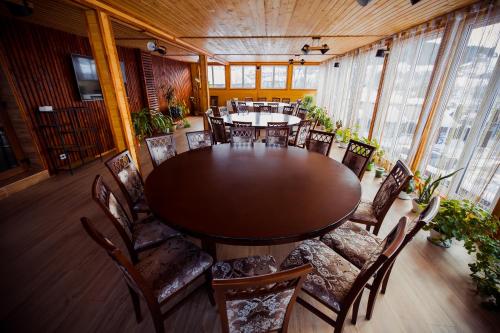 a large dining room with a table and chairs at Гуцульська світлиця in Bukovel