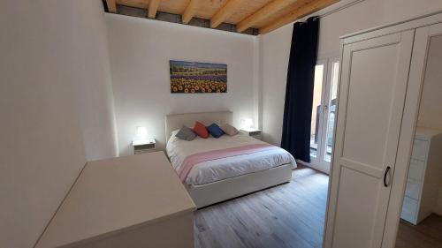 Ένα ή περισσότερα κρεβάτια σε δωμάτιο στο VIgarani Apartments