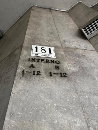 a sign on the floor of a sidewalk at ARBI VENICE STATiON in Mestre