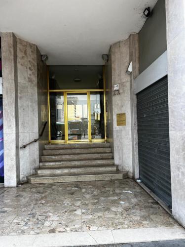 a building entrance with stairs and a door at ARBI VENICE STATiON in Mestre