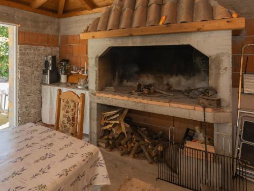 a fireplace in a room with a bed in front of it at Mara in Šibenik