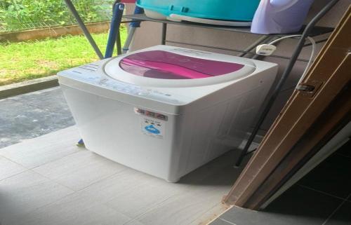 a washing machine sitting inside of a vehicle at Hostel KLIA in Sepang