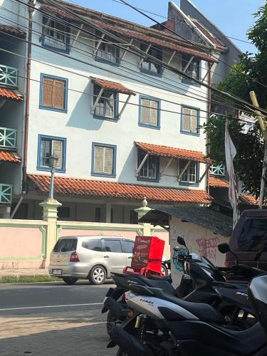 a group of motorcycles parked in front of a building at DAMPAR BEACH C3 SELATAN KM69 