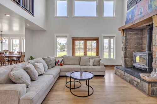 a living room with a couch and a fireplace at Three Bears Get Away farmhouse in Hamilton