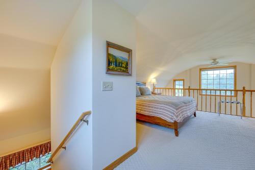 a bedroom with a bed and a balcony at Vacation Rental Home in the Berkshires! in Williamstown