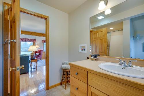 a bathroom with a sink and a mirror at Vacation Rental Home in the Berkshires! in Williamstown