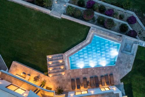 an overhead view of a swimming pool in a yard at Villa Indira in Kalithies