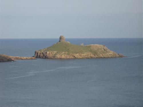 an island in the middle of the ocean at Hôtel U Pozzu in Sisco