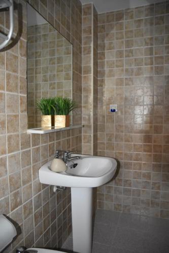 a bathroom with a sink and a mirror at SIERRA LAGO in Córdoba