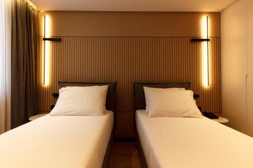Katil atau katil-katil dalam bilik di Caramel Boutique Hotel