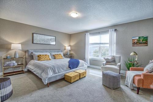a bedroom with a bed and a window at 2 Bedroom townhome, super close to downtown FC! in Fort Collins