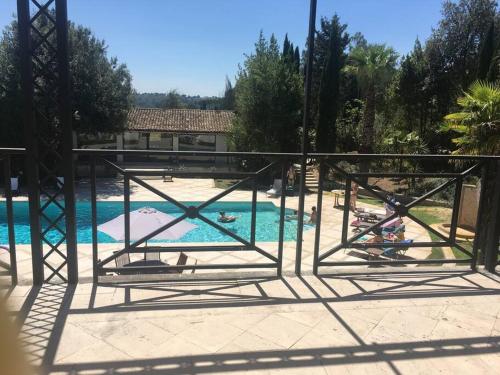 a view of a swimming pool with people in the water at Rome villa swimming pool in Campagnano di Roma