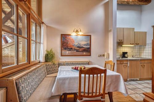 a kitchen with a table with apples on it at Zyprianhof in Nova Levante