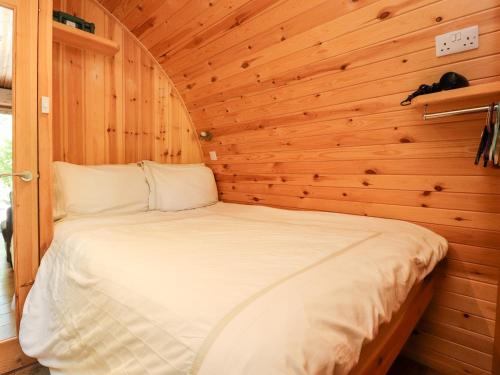 מיטה או מיטות בחדר ב-Homewood Pod