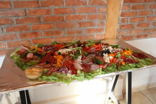 a large platter of food on a table at Casa Simion in Sibiu