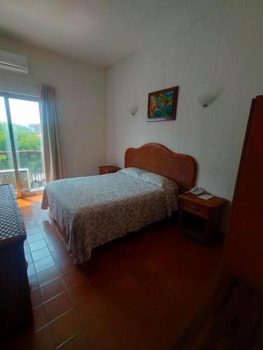 Hotel Posada Doña Lalaにあるベッド