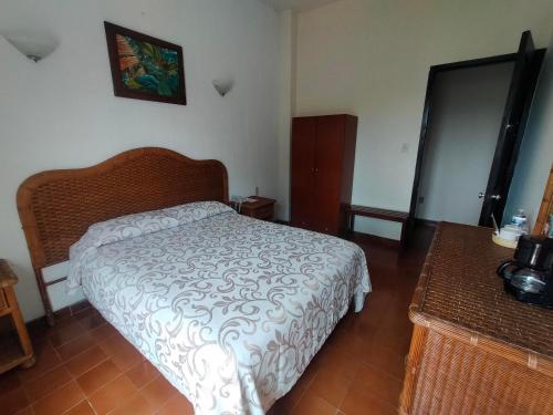 Hotel Posada Doña Lalaにあるベッド
