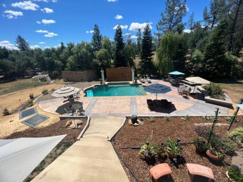 a swimming pool in a yard with at The Oasis in Redding