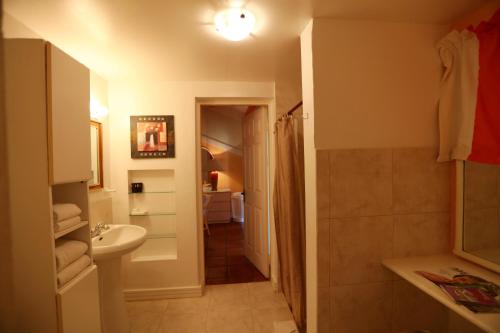 a bathroom with a sink and a toilet at The Legend Garden Condos in Saint Peter
