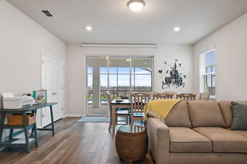 a living room with a couch and a table at Luxury Six Bed Four in Bath Windsor Island BSV1707 in Davenport