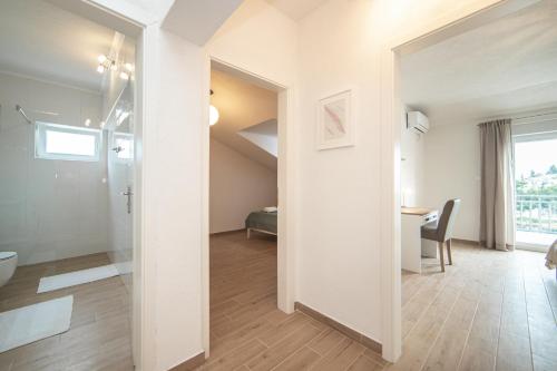 a bathroom with a sink and a toilet in a room at Lakeview Apartments in Ploče