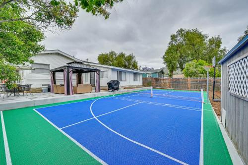 a tennis court in the backyard of a house at Updated Poway Farmhouse Walk to Parks! in Poway